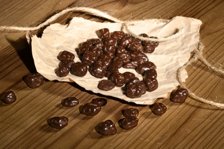 Chocolate-coated candied orange cubes