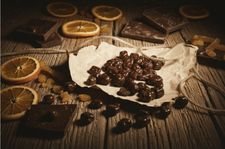 Chocolate-coated candied orange cubes